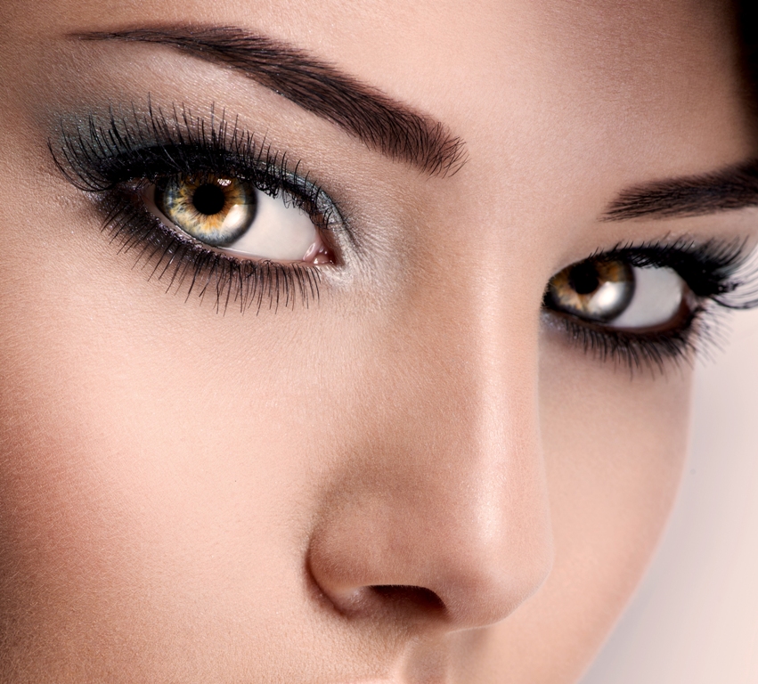 model's face of  woman with beautiful blue eyes with long eyelashes