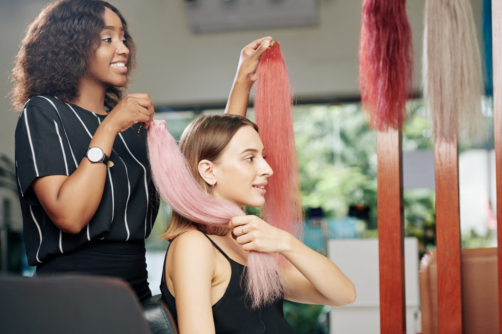 salon-client-choosing-light-pink-hair-extensions-2021-08-26-19-51-55-utc 1024x683